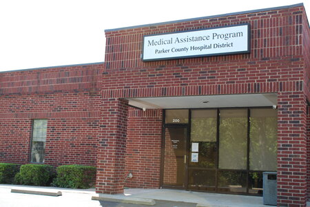 Picture of the Parker County Hospital District Medical Assistance Program brick building.